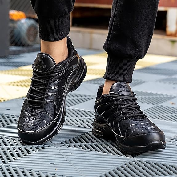 Baskets modernes noires pour homme avec semelle pneumatique et logo AIR.