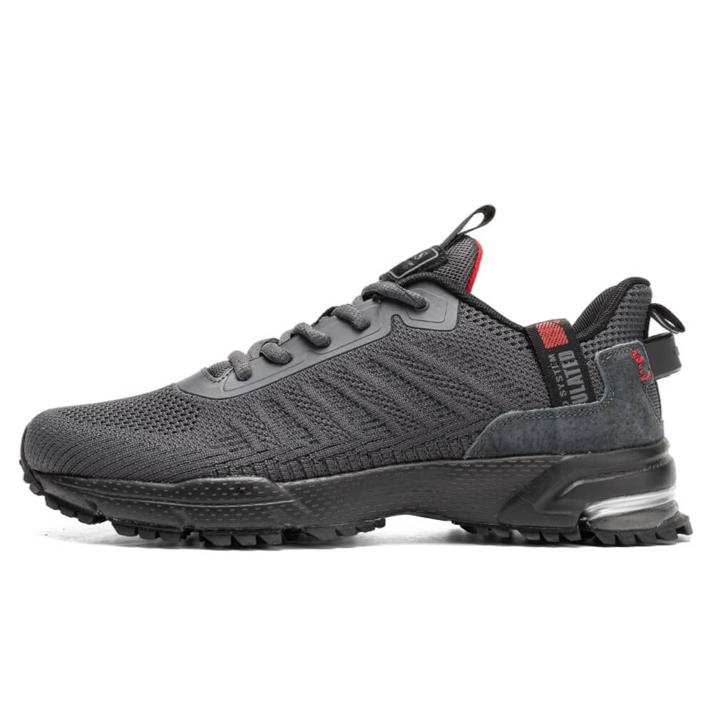 Chaussure de sport gris foncé avec tige en maille respirante et semelle en caoutchouc résistant.