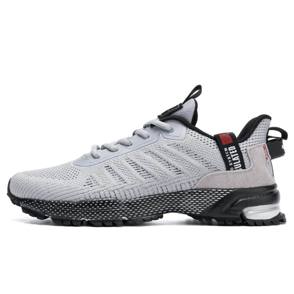 Chaussure de sport gris clair avec tige en maille respirante et semelle en caoutchouc résistant.