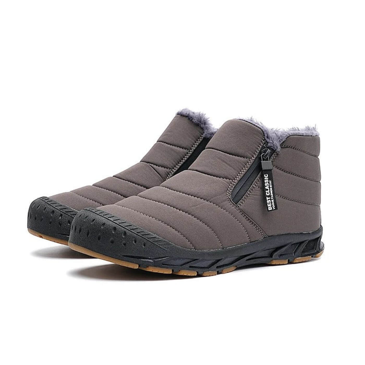 Bottes d'hiver grises isolées avec tige hydrofuge. Conçues pour le confort et la chaleur en hiver.