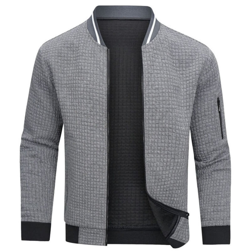 Veste grise pour homme avec un motif matelassé à la mode et une fermeture à glissière.