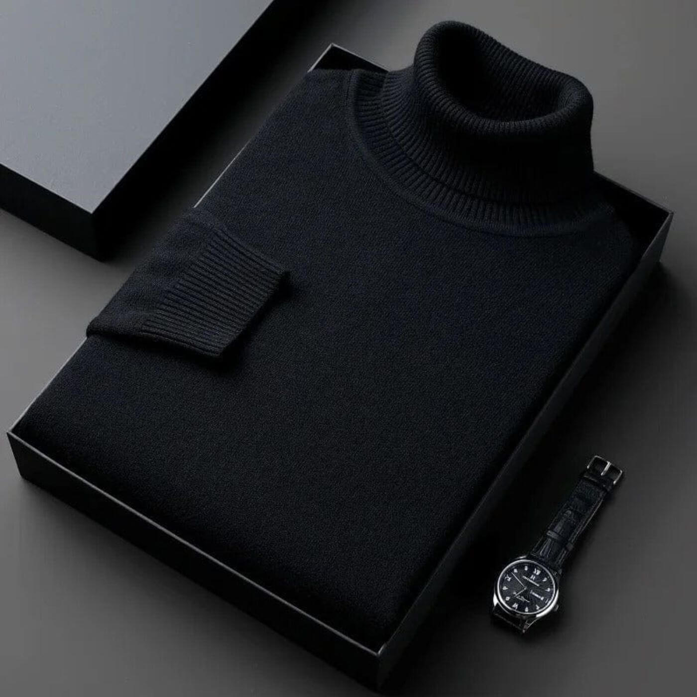 Pull à col roulé noir élégant, soigneusement plié dans une boîte cadeau haut de gamme. Idéal pour l'hiver